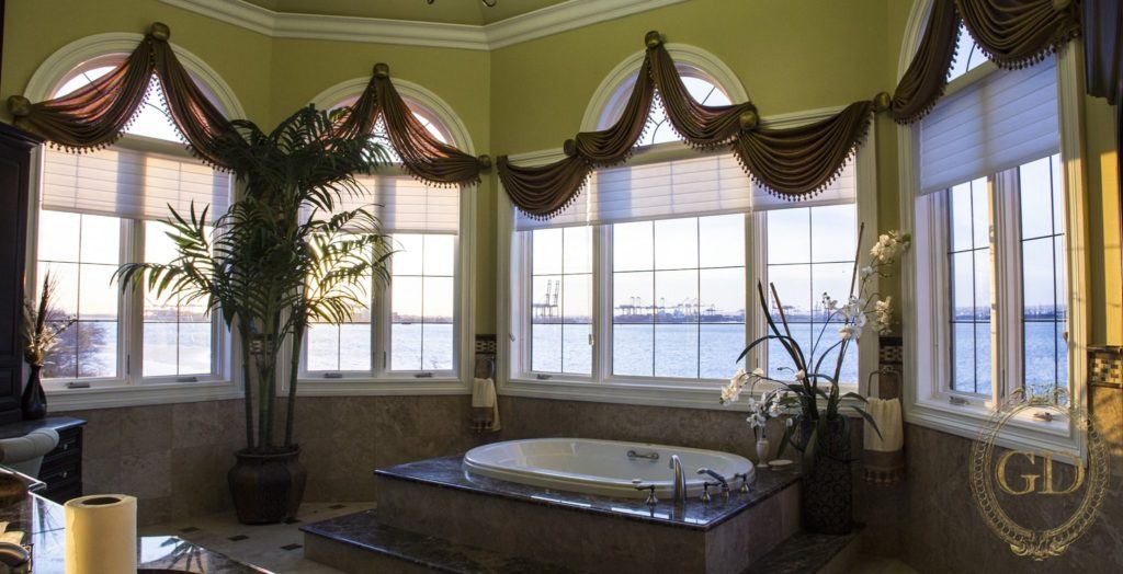 a bathroom with a large tub and a large window